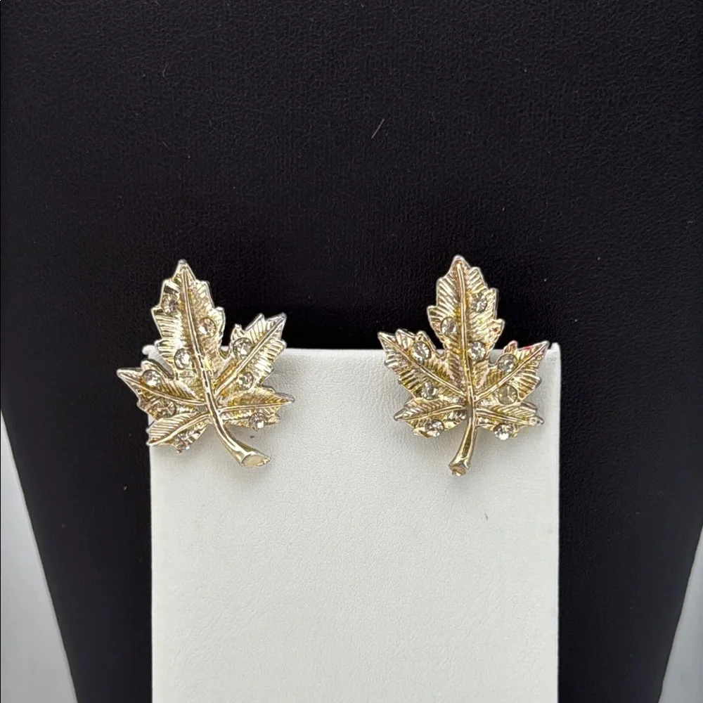 Gold tone textured leaf rhinestone accent screw back statement earrings